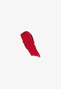 Trace de rouge à lèvres rouge avec une texture lisse sur fond blanc.
