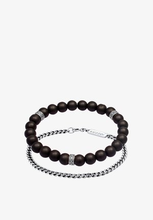 Juodos matinės karoliukų apyrankės su sidabro detalėmis ir grandinėlės jungtimi. Apyrankėje pridėta įspausta KUZZOI žymė ir dekoratyviniai metaliniai karoliukai.