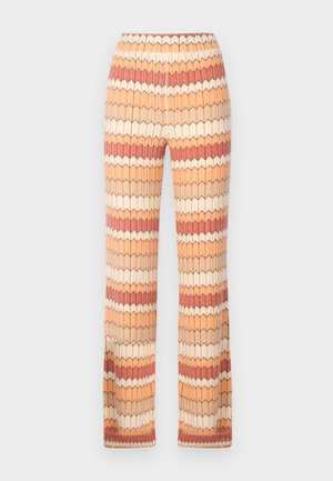 Weite Hosen mit einem strukturierten Zickzackmuster in Orange, Beige und Creme. Elastischer Taillenbund für Komfort und passgenauen Sitz.