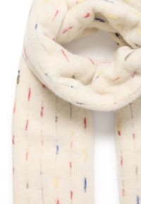 Hvid uld tørklæde med multikolor speckles i rød, blå, gul og grøn. Blød tekstur og cylindrisk form, designet til at vikles komfortabelt.