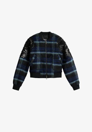 Plava i crna karo bomber jakna od teksturiranog tkanja, s crnim šljokičastim detaljima te rebrastim manžetnama i rubom. Prednji zatvarač i džepovi.
