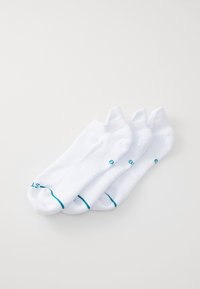White ankle socks, made of a textured material, featuring a contrasting teal stripe at the top and logo accents near the heel.