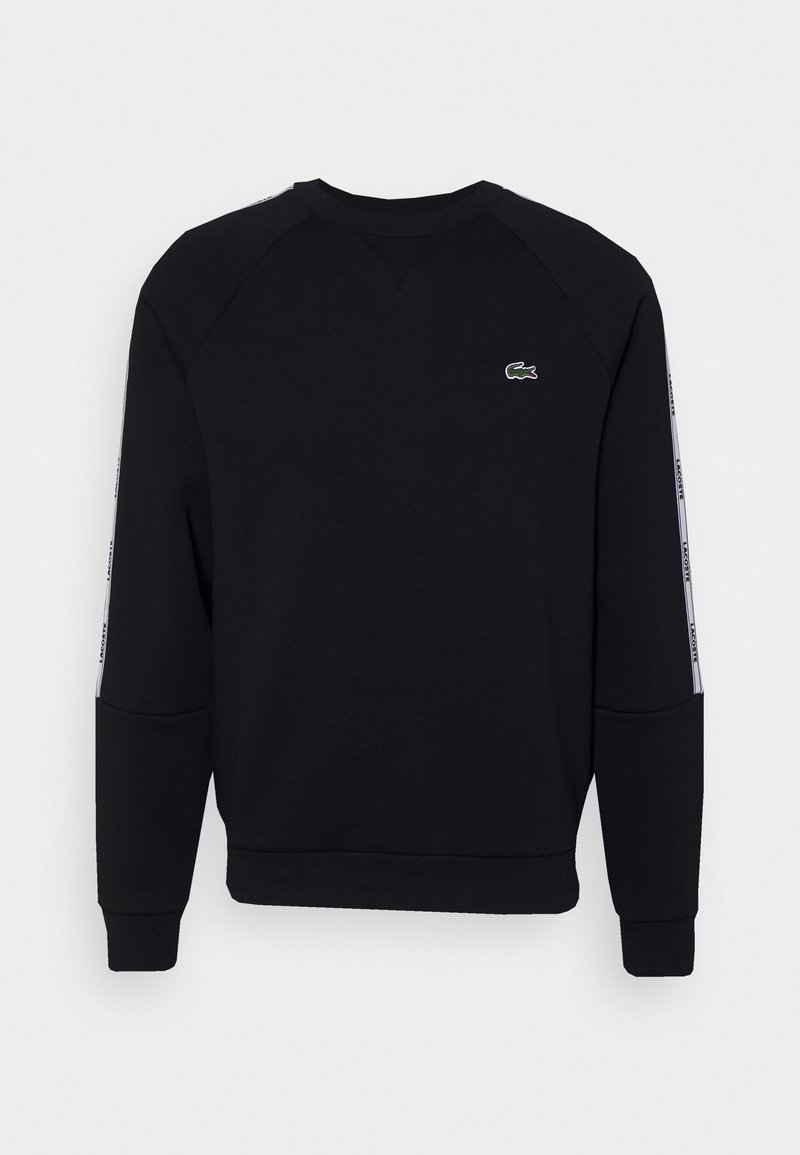 Black sweatshirt with raglan sleeves, featuring a green embroidered logo and white side stripes with text. Soft fabric and ribbed cuffs.
