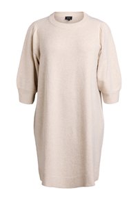 Stickad klänning i ljusbeige, med rund halsringning, korta puffärmar och ribbade manschetter och i nederkant. Mjuk textur, avslappnad passform.