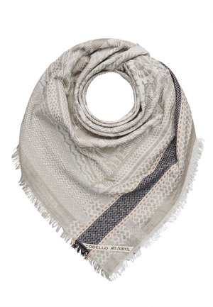 Écharpe beige clair et grise à motifs avec des bords frangés et une bordure en zigzag noire et orange, pliée en forme circulaire.