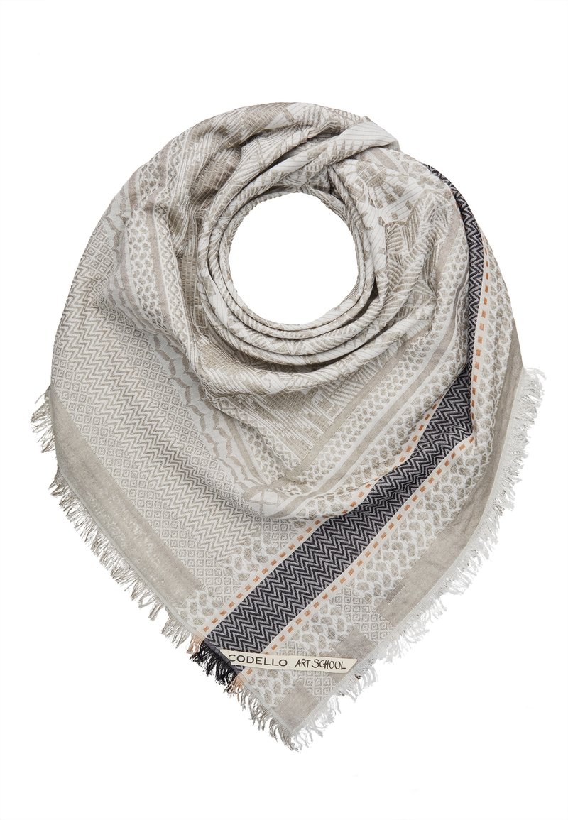 Écharpe beige clair et grise à motifs avec des bords frangés et une bordure en zigzag noire et orange, pliée en forme circulaire.