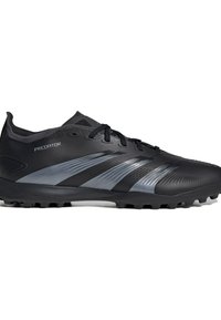 Black athletic shoes with a textured upper, featuring reflective silver stripes, a low profile, and rubber studs on the outsole for traction.