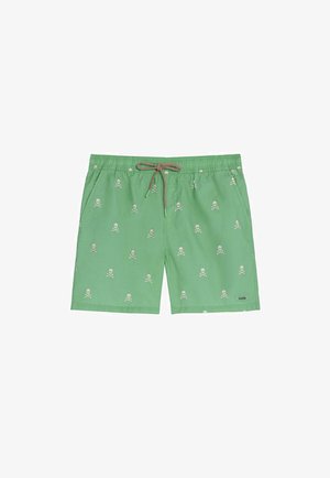 Bañador verde con estampado blanco de calaveras y huesos cruzados y cintura con cordón marrón.