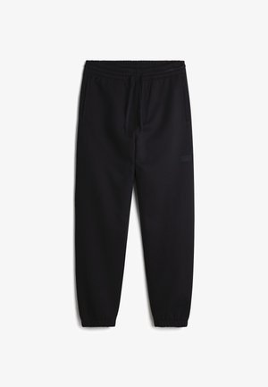 Black sweatpants with an elastic waistband and drawstring, tapered ankles, and a subtle brand logo on the left side. Soft fabric texture.