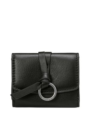 Black leather wallet with flap closure secured by a black strap looped through a silver metal ring on a white background.