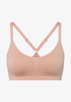 Weicher, hellrosafarbener BH aus sanftem Stoff mit glatter Oberfläche, ausgestattet mit überkreuzten, verstellbaren Trägern und einem zentralen dekorativen Ringdetail.