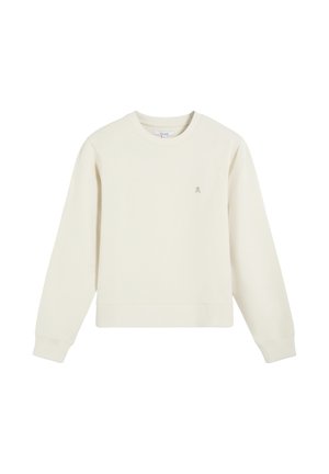 Sudadera de manga larga color crema con cuello redondo, puños y dobladillo acanalados, y un pequeño logo bordado de calavera en el lado izquierdo del pecho.