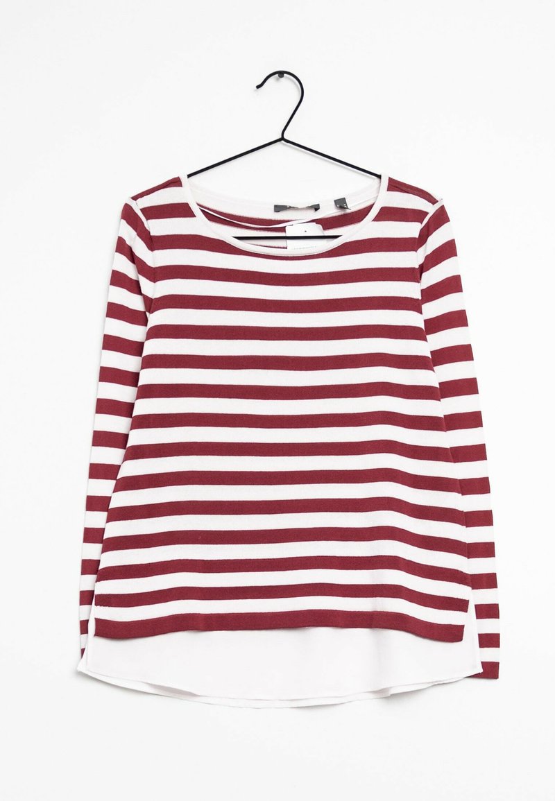 Haut à manches longues rayé rouge et blanc avec un col rond et une coupe asymétrique, fabriqué en tissu doux et avec une étiquette à l'arrière.