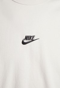 Nike Sportswear PREM ESSNTL SUST - Camisola de manga comprida - light bone/black