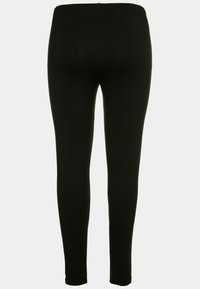 Leggings neri realizzati in un tessuto elasticizzato, con una vita elasticizzata e un design aderente che si estende fino alle caviglie.