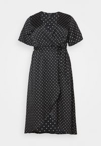 Schwarzes Wickelkleid mit kurzen Ärmeln, weißen Punkten, V-Ausschnitt und Gürtelbindeband in der Taille. Weicher Stoff mit fließender Silhouette.