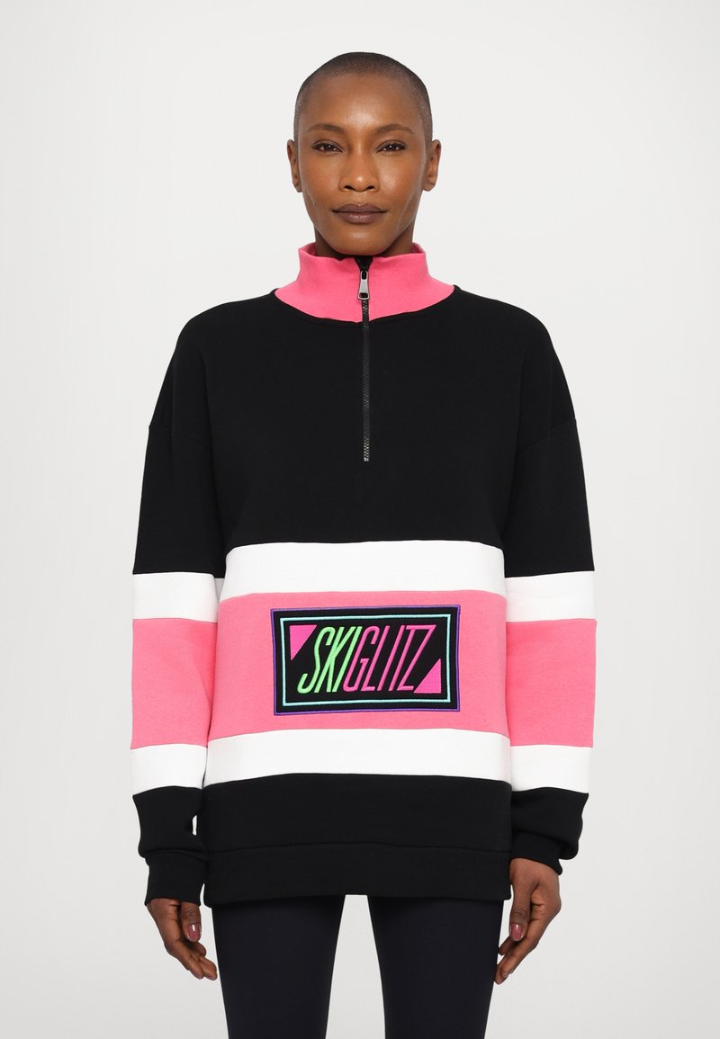 Hanorac cu fermoar de culoare neagră, roz și alb, cu mâneci lungi; are un patch cu logo în verde și roz; material din bumbac moale, croială lejeră.