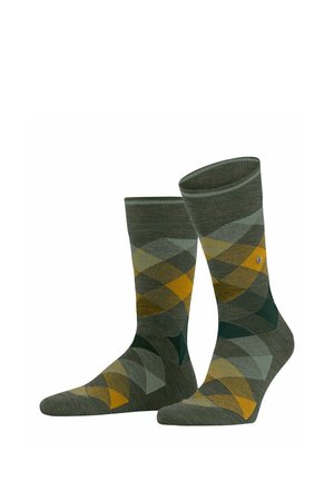 Calze argyle verdi con motivo a diamante giallo e teal, bordi a costine e una texture liscia. Adatte per un abbigliamento casual.