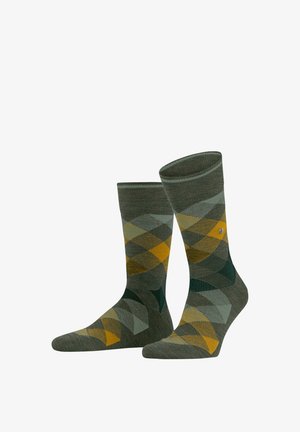 Grüne Argyle-Socken mit gelben und türkisfarbenen Rautenmustern, gerippten Bündchen und einer glatten Textur. Geeignet für den Freizeitgebrauch.