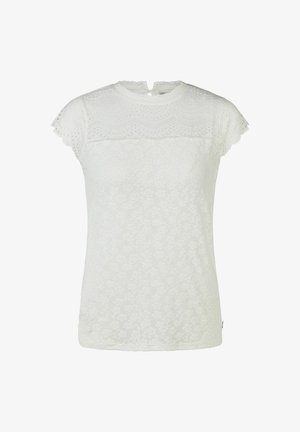 Weiße Spitzenbluse mit kurzen Ärmeln, floralen Mustern, geschwungenem Ausschnitt und halbtransparenten Details an Schultern und oberer Brust.