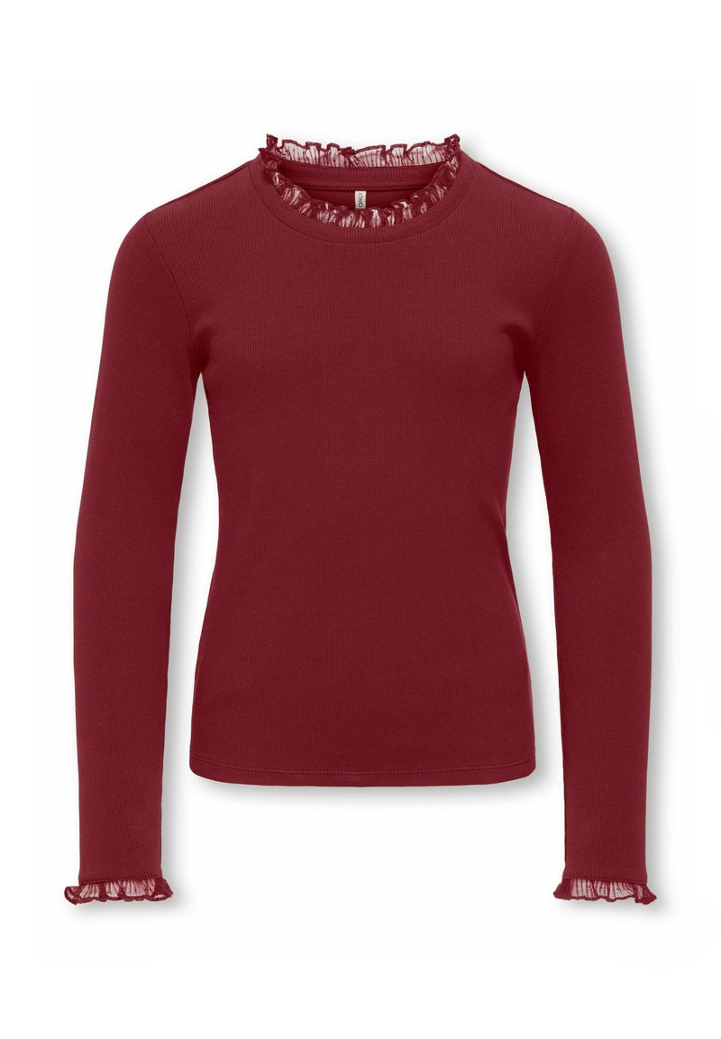 Langermet, ribbestrikket topp i dyp rød med rund hals med gjennomsiktig volangkant og rysjekanter. Mykt teksturert stoff.