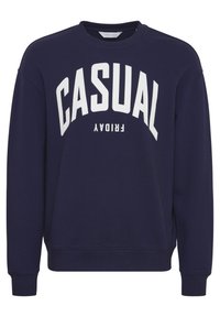 Námornícky modrý sveter so bielym textom "CASUAL FRIDAY". Má okrúhly výstrih a ribbed manžety, vyrobený z mäkkej bavlnenej látky.