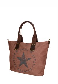 Borsa in tela marrone con grafica di una stella scura, dettagli in pelle e doppie maniglie. Presenta lettering vintage in un design circolare.