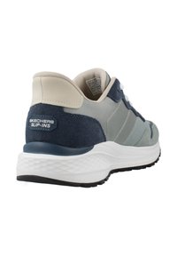 Men's Skechers slip-on shoe in grey and navy with suede and mesh upper, cushioned white midsole, and textured black outsole.