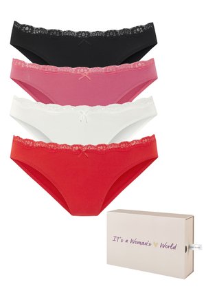Soutien-gorge blanc, sans coutures, avec un décolleté plongeant et des fines bretelles, associé à des culottes assorties avec des bordures en dentelle, posées sur un tapis doux.