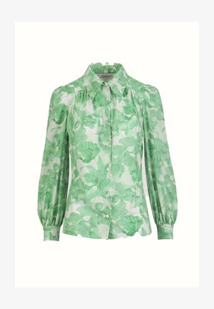 Blusa a maniche lunghe con stampa floreale verde, chiusura frontale con bottoni, polsini aderenti e colletto classico su sfondo bianco.