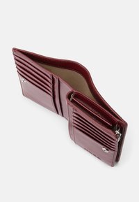 Burgundy leather wallet featuring multiple card slots, a zippered compartment, and a smooth texture with subtle stitching details.