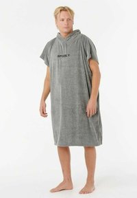 Szary poncho z frotte z kapturem, z krótkimi rękawami. Na przodzie znajduje się czarne logo "RIP CURL". Miękka tekstura i średniej długości design.