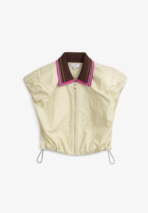 Veste courte beige clair avec un col côtelé marron présentant des rayures roses, blanches et marron. Comprend une fermeture éclair à l'avant et deux poches poitrine.