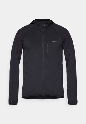 Schwarze, langärmlige Jacke aus strukturiertem Stoff, mit einem Reißverschluss vorne, Kapuze und zwei seitlichen Taschen. Logo auf der oberen linken Seite.