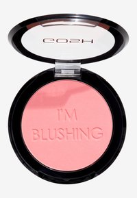 Blush compatto nero con coperchio trasparente, caratterizzato da una polvere rosa testurizzata con la scritta "I'M BLUSHING" in caratteri in grassetto.