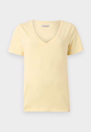 Ανοιχτό κίτρινο βαμβακερό T-shirt με κοντά μανίκια και V-λαιμόκοψη, σε άνετη γραμμή, με εμφανή ετικέτα της μάρκας Anna Field στο εσωτερικό του γιακά.