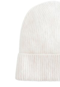 Light pink ribbed knit beanie hat with a folded cuff. Made from soft, textured fabric, featuring vertical lines and a seamless crown.