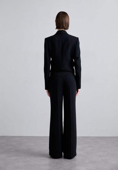 Stine Goya ISAAC CREPE - Hlače - jet black