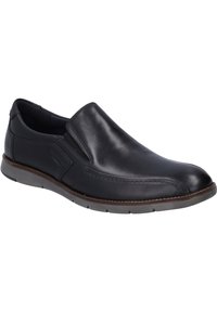 Zapato negro de piel deslizante con paneles elásticos en los laterales, puntera redondeada y suela de goma. Presenta detalles de costura y un acabado suave.