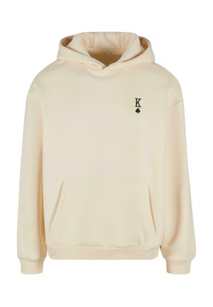 Felpa color crema realizzata in morbido tessuto, con tasca frontale, polsini a coste e un piccolo logo a forma di piccone nero con la lettera "K" sul petto.