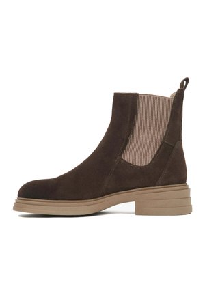 Brown suede ankle boot with ribbed beige elastic side panels and a pull tab. Chunky beige sole with layered detailing.