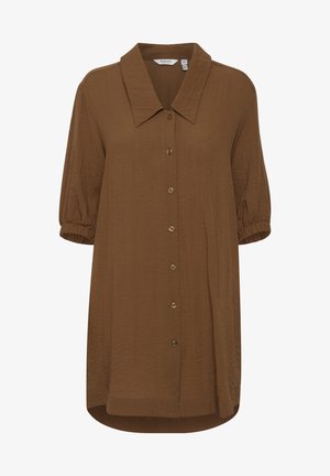 Brun, knappad skjorta med spetsig krage, korta puffärmar och avslappnad passform. Tillverkad av lätt tyg med en mjuk textur.