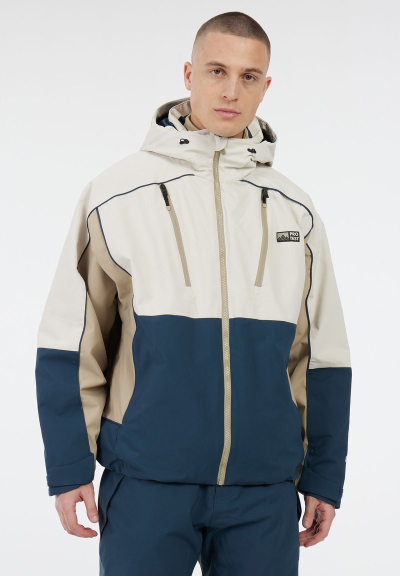 Heren geïsoleerde jack, met beige en marineblauwe kleurvakken, ritszakken, waterdichte stof en verstelbare capuchon met trekkoorden.