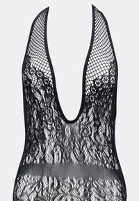 Svart blond bodysuit med dyp V-hals design, fiskenetttekstur og intrikate blomster mønstre. Minimalistiske kanter og passform fremhever strukturen.