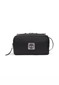 Borsa nera, rettangolare, realizzata in tessuto resistente, dotata di una placca con logo argentato e chiusura con zip. Include una tracolla e una superficie testurizzata.