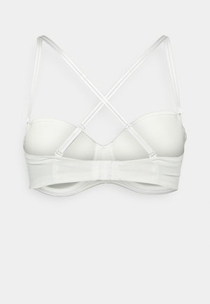 Valge rinnahoidja polsterdatud tassidega, tagant reguleeritavate risti kinniste rihmade ja kolme konksuga kinnitusega laial laiendil.