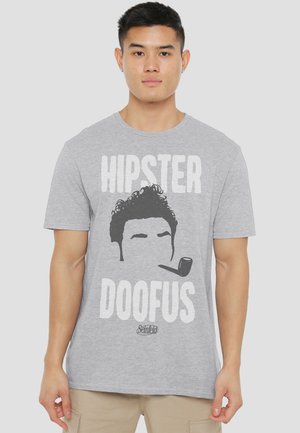 Young man wearing gray t-shirt with black graphic of a pipe-smoking silhouette and text "HIPSTER DOOFUS" and "Seinfeld" logo.