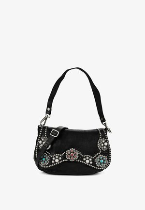 Black leather shoulder bag with silver studs and turquoise, red, and white decorative stones, featuring an adjustable strap and metal clasps.