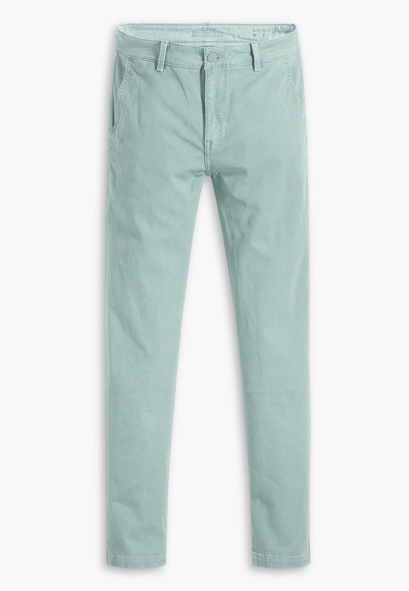 Chinos verde menta claros con una textura suave, piernas rectas, bolsillos frontales, cierre de botón y cremallera, y presillas para cinturón en la cintura.