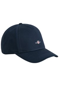Marinblå baseballkeps i bomull med böjd skärm, med kontrasterande vit sömnad och en liten logotyp på framsidan.